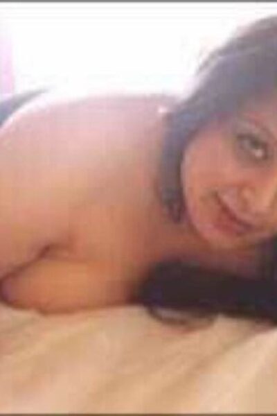 Busty Indian escort laid on her bed
