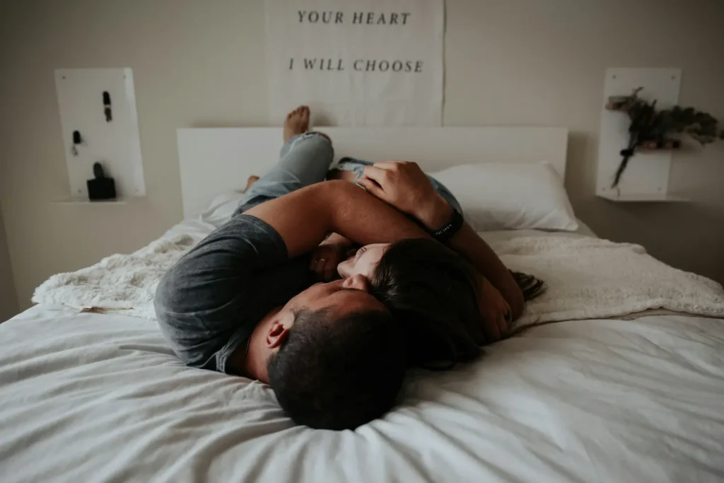 Couple cuddling on the bed