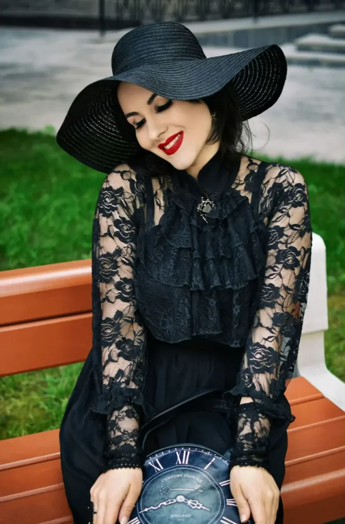 Attractive Dumfries escort in a black hat and outfit