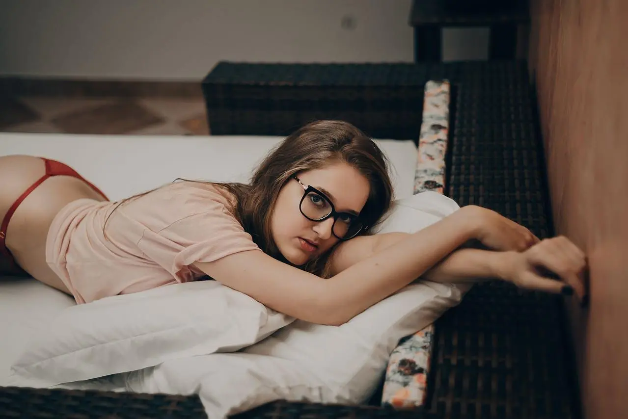London escort laid on her bed