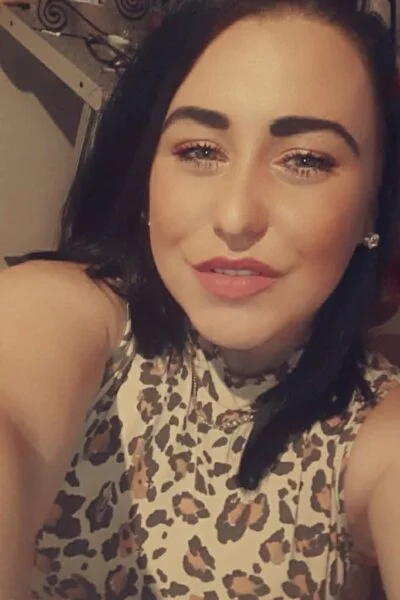 Brunette Cork Escort in a leopard print top