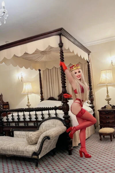 Sexy blonde escort wearing a crown