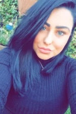 Brunette Cork Escort in a black jumper