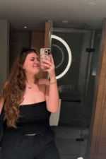 Brunette Bath escort taking a selfie in a bathroom