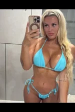 Busty blonde Edinburgh escort in a light blue bikini