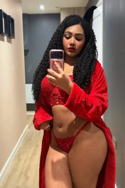 Curvy ebony escort in red lingerie