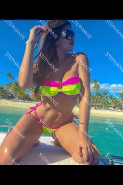 Brunette Dublin escort in a bright bikini