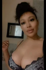 Busty British Escort wearing a bra