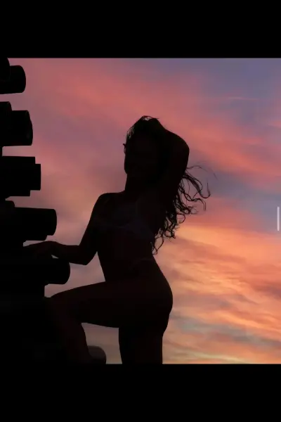 Escort posing in the evening sky