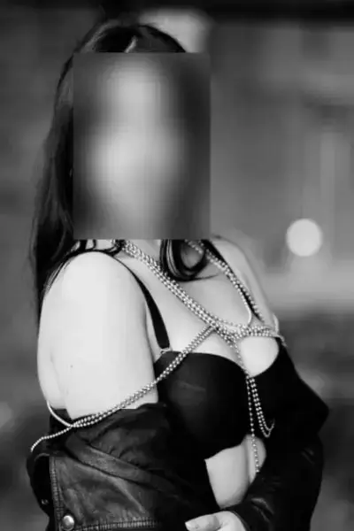 Brunette Escort in chain underwear