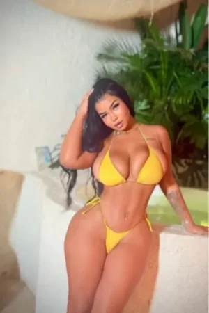 Super busty Nottingham escort wearing a yellow bikini