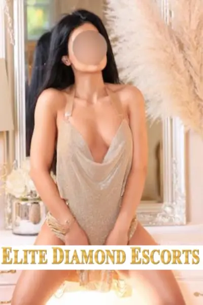 British Escort in a beige shimmery dress