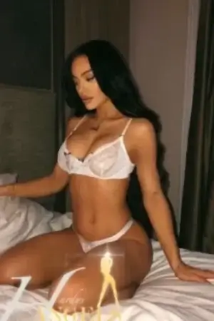 Sexy brunette escort in white lingerie