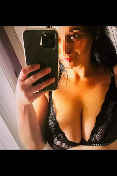 Busty Czech Escort in a black bra