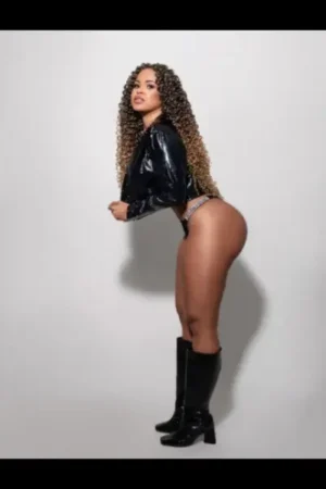 Latina Escort in PVC jacket and boots