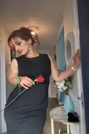 Arabic Escort holding a rose