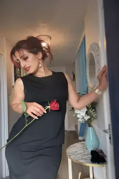 Arabic Escort holding a rose
