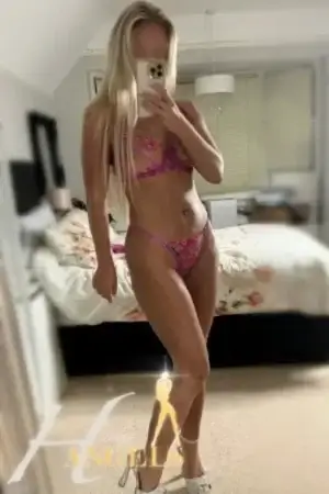 Busty blonde escort in floral underwear