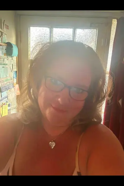 BBW escort wearing glasses