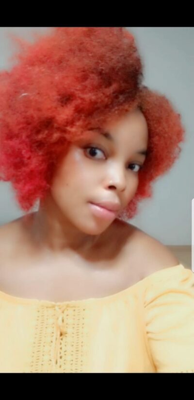 Ebony escort with dyed red hair