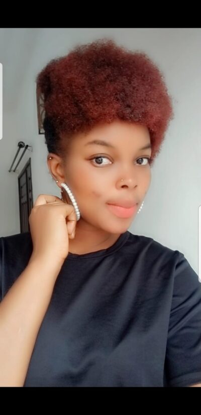 Ebony escort with dyed red hair