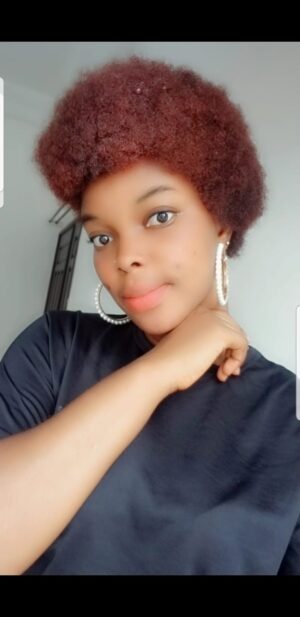 Ebony escort with dyed red hair