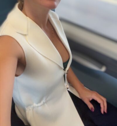 London escort in a white suit