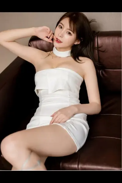 Asian Bangor escort in a white dress