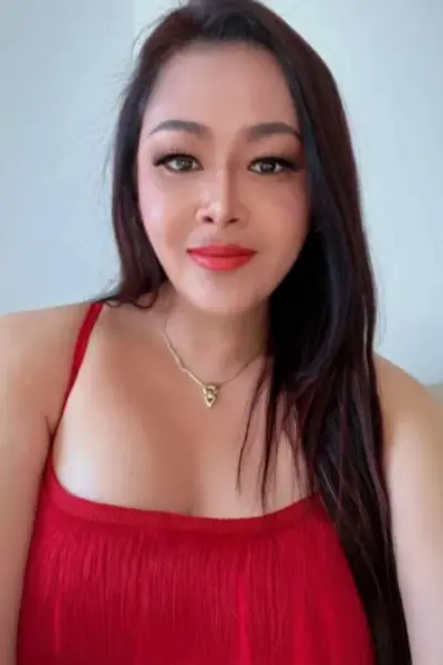 Thai escort weariing a red dress