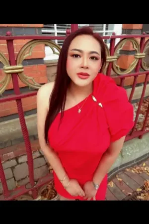 Thai escort weariing a red dress