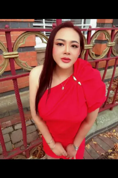 Thai escort weariing a red dress