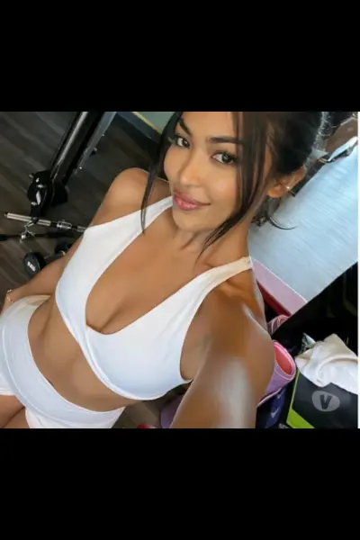 Thia escort in white gym gear