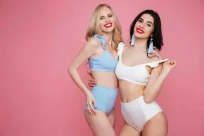 Blonde and brunette escort in lingerie