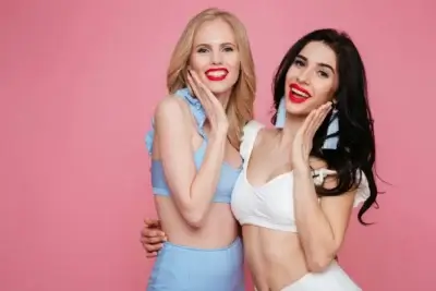 Two escorts wearing bright red lipstick