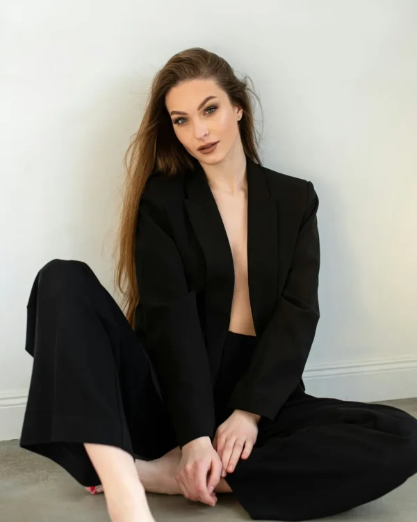 Sexy Drogheda escort wearing a black pantsuit