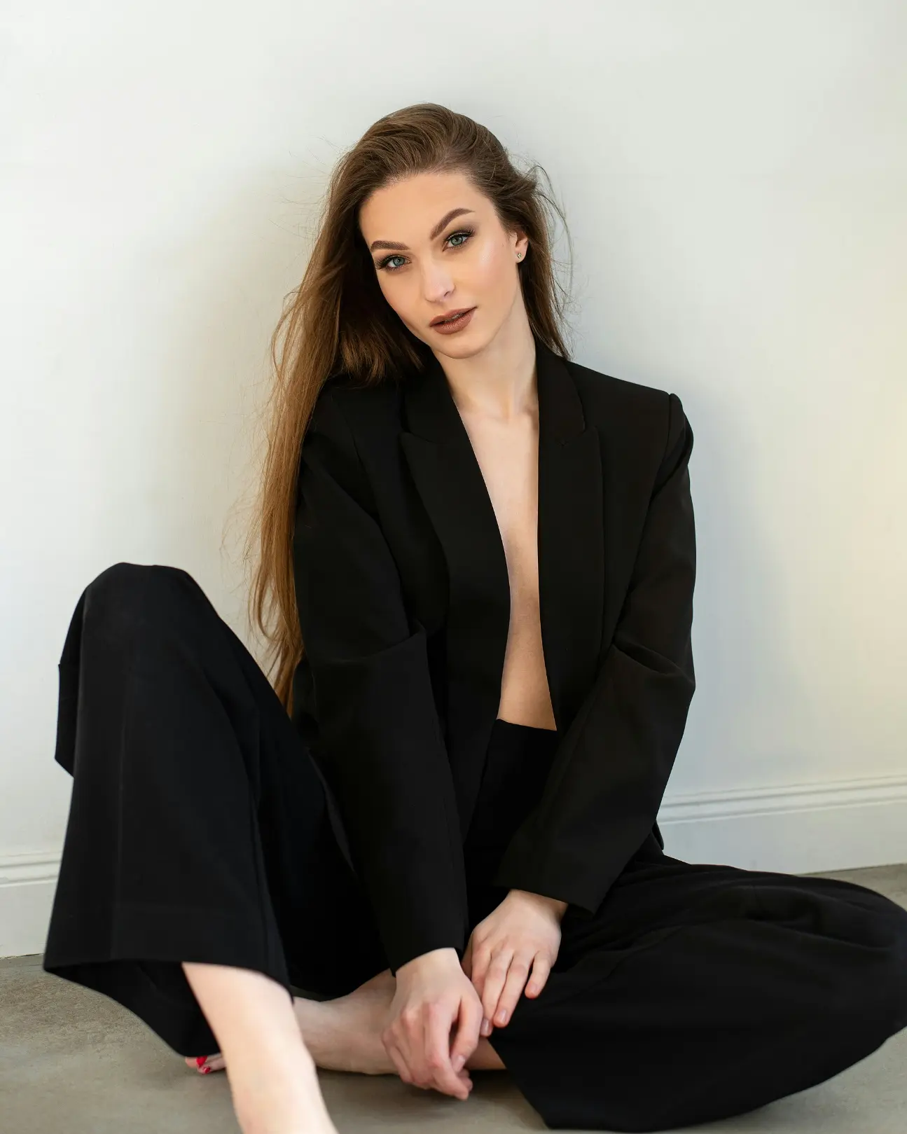 Sexy Drogheda escort wearing a black pantsuit