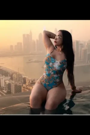 Elstow Escort posing in an infinity pool