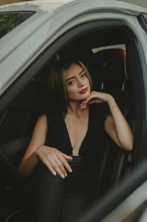 Sexy Tipperary escort posing in a car