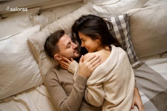 Young couple embracing in bed