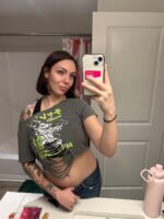 Tattooed Leeds escort taking a selfie in the bathroom