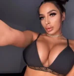 Super busty Cornwall Escort wearing a black bra