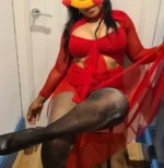 Curvy black escort in a red dress