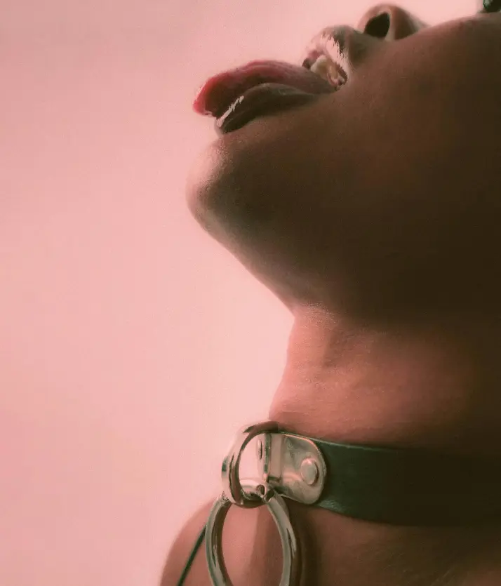 Bondage girl with her tongue out