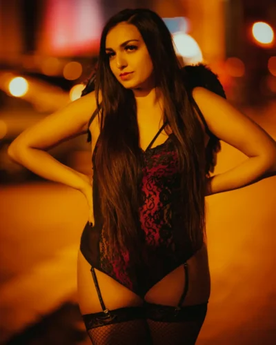 Sexy Hull escort in a dark bodice and stockings