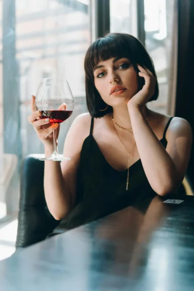 Sussex escort drinking red wine