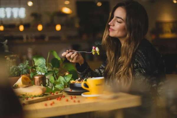 Woman eating food on a date