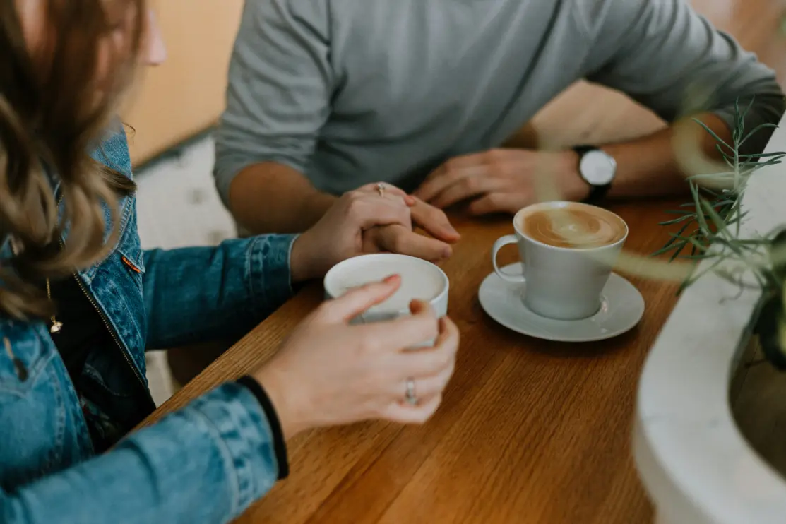 Man and woman sharing a coffee on a date