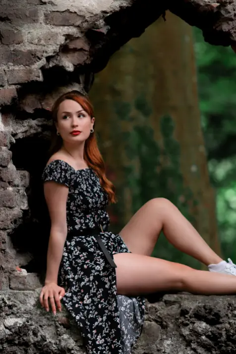 Flame haired Louth escort in a dress