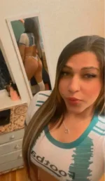 Watford escort showing her bum in a full-length mirror