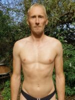 Male escort in black swimwear